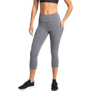 The Athleta Ultimate Stash Pocket 7/8 Tight in size SP